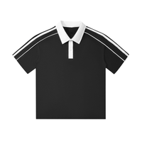 Black polo shirt with white collar and placket, featuring white stripe accents on the shoulders and sleeves.