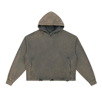 A brown, distressed-looking hooded sweatshirt with long sleeves. The fabric has a faded appearance, and the hem is frayed with visible wear. The hood is down, and the sweatshirt is laid flat against a white background.